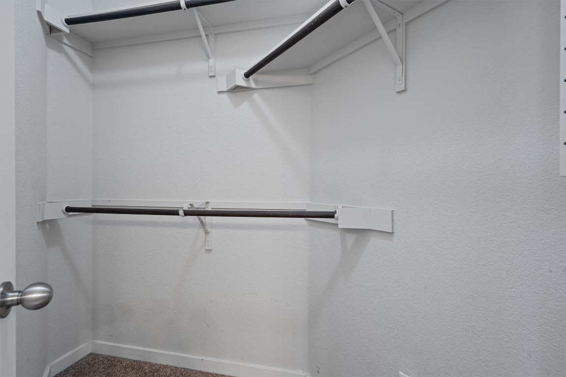 16304 Travesia Way Austin, TX 78728 - Photo 20 of 33 a view of a room with racks on the wall