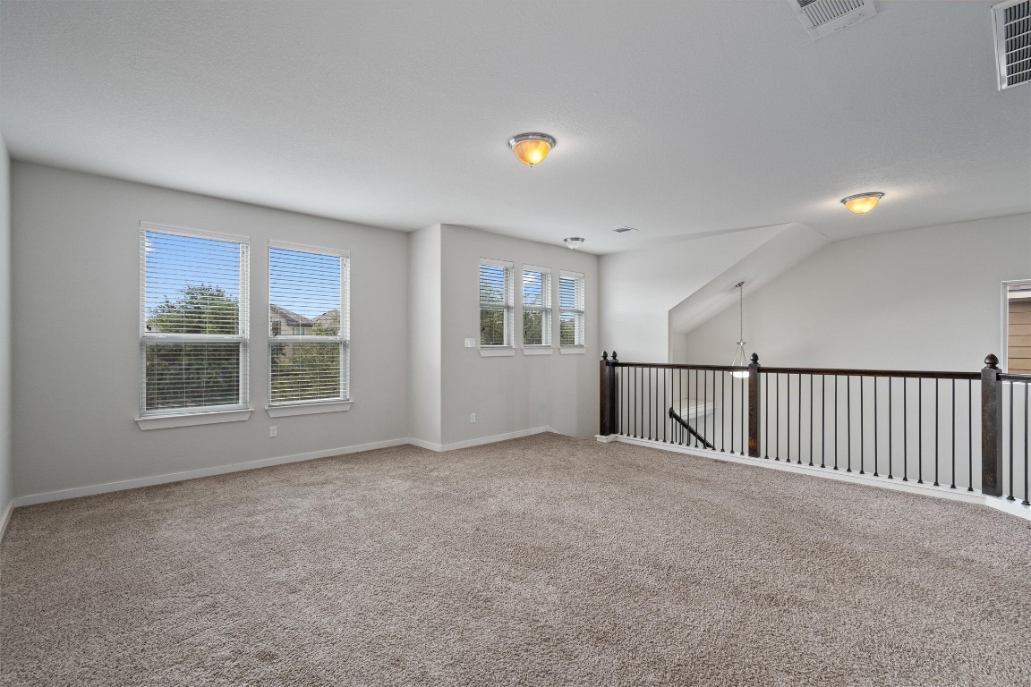 16304 Travesia Way Austin, TX 78728 - Photo 21 of 33 a view of an empty room with a window