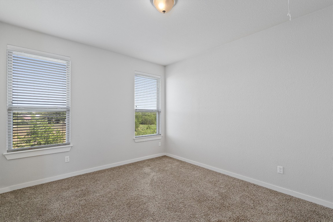 16304 Travesia Way Austin, TX 78728 - Photo 26 of 33 an empty room with windows