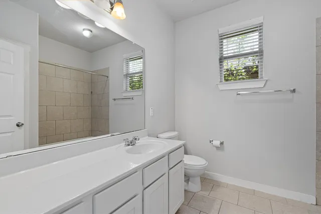 a view of a backyard with wooden fence