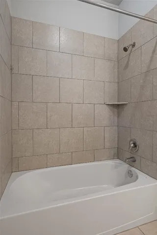 a view of a house with backyard and a garden