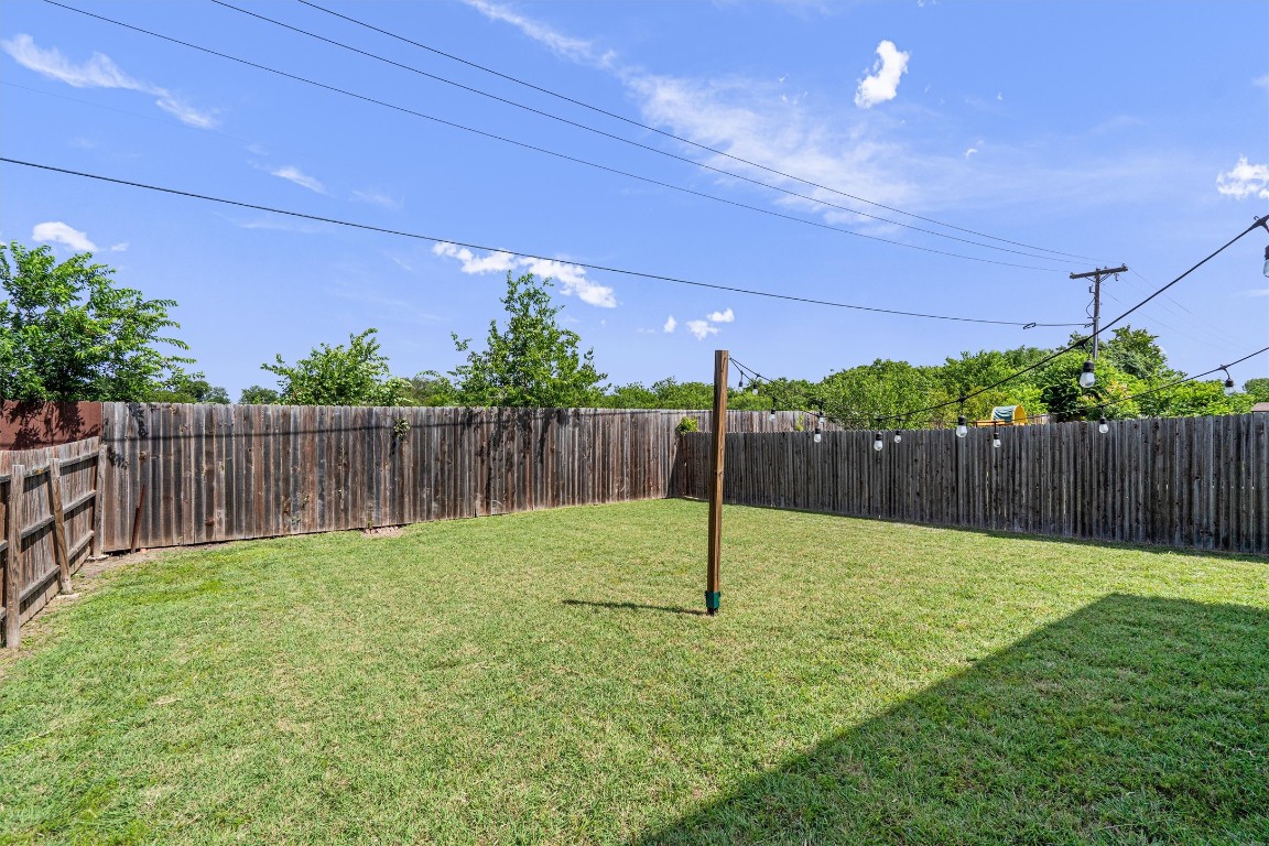 16304 Travesia Way Austin, TX 78728 - Photo 30 of 33 a view of a backyard with wooden fence