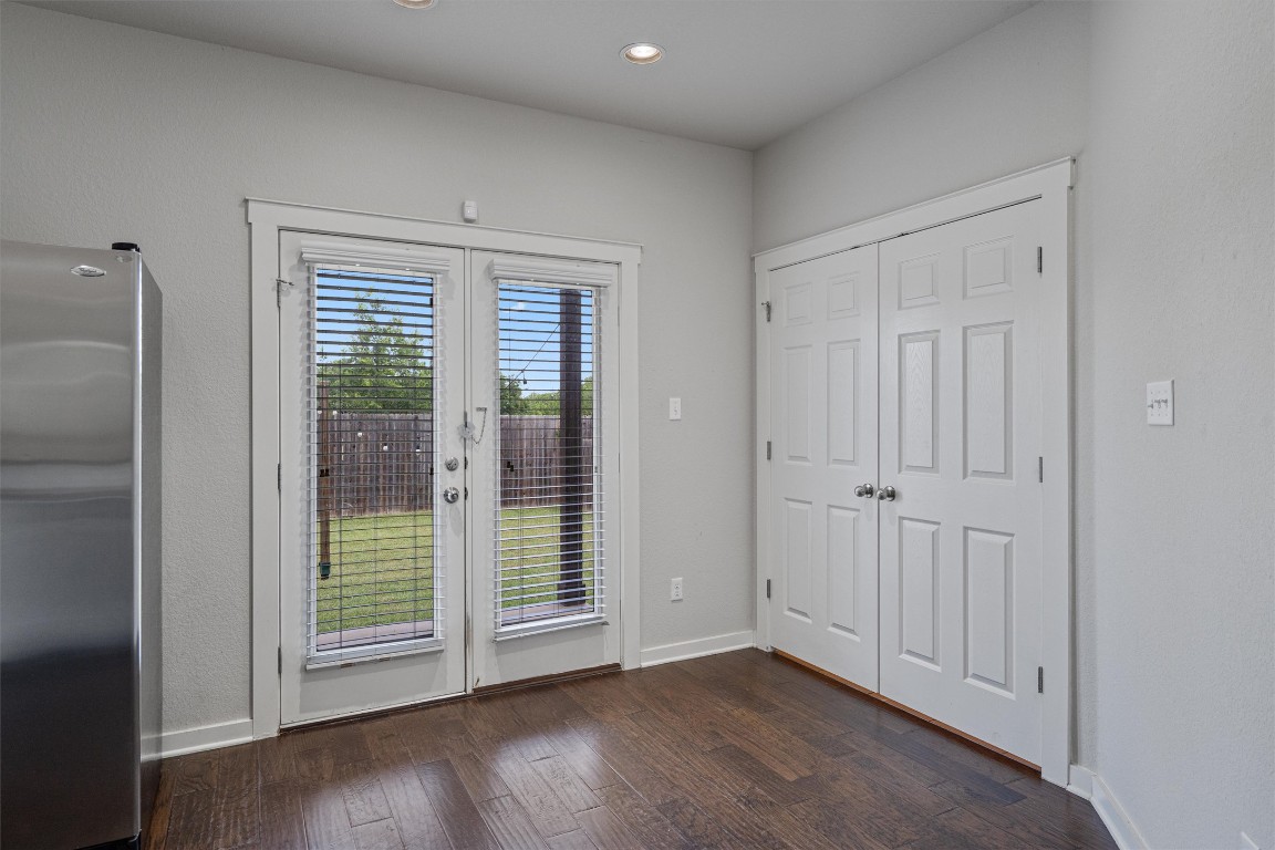 16304 Travesia Way Austin, TX 78728 - Photo 9 of 33 a view of an empty room with wooden floor and a window