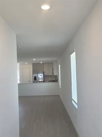 a view of a kitchen with a sink and cabinets