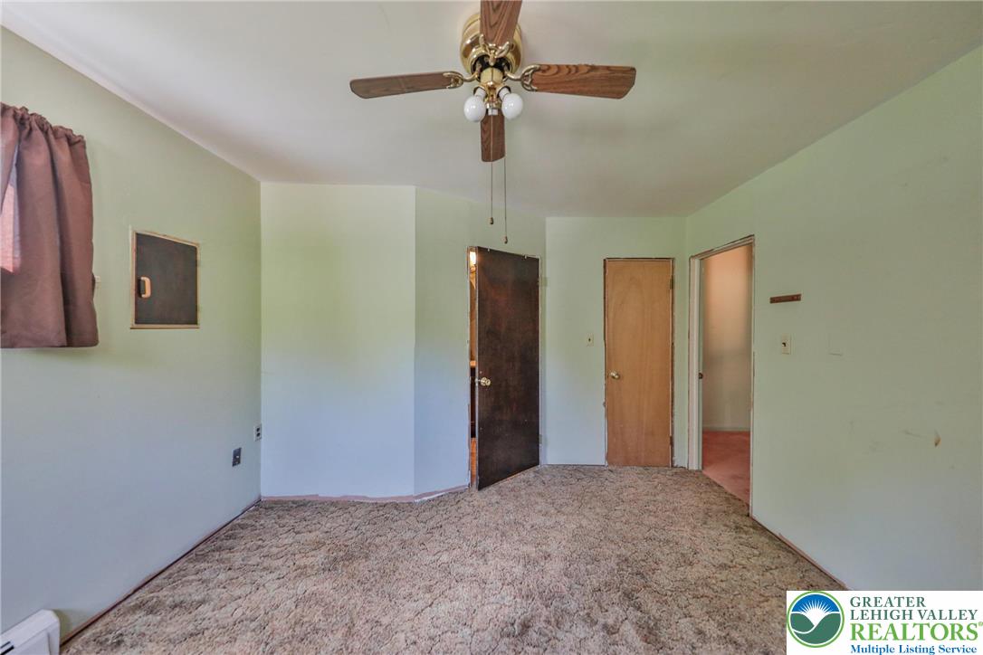 331 Cranberry Creek Road Cresco, PA 18326 - Photo 56 of 95 A classic ceiling fan provides comfort in this well-lit room, ready for your personal touch.