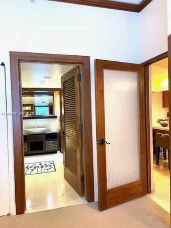 a view of a bathroom with a tub and mirror