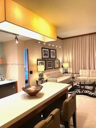 a kitchen with a sink appliances and cabinets