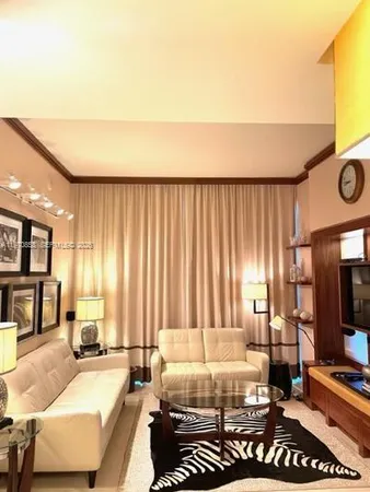 a bed room with a bed furniture and a flat screen tv