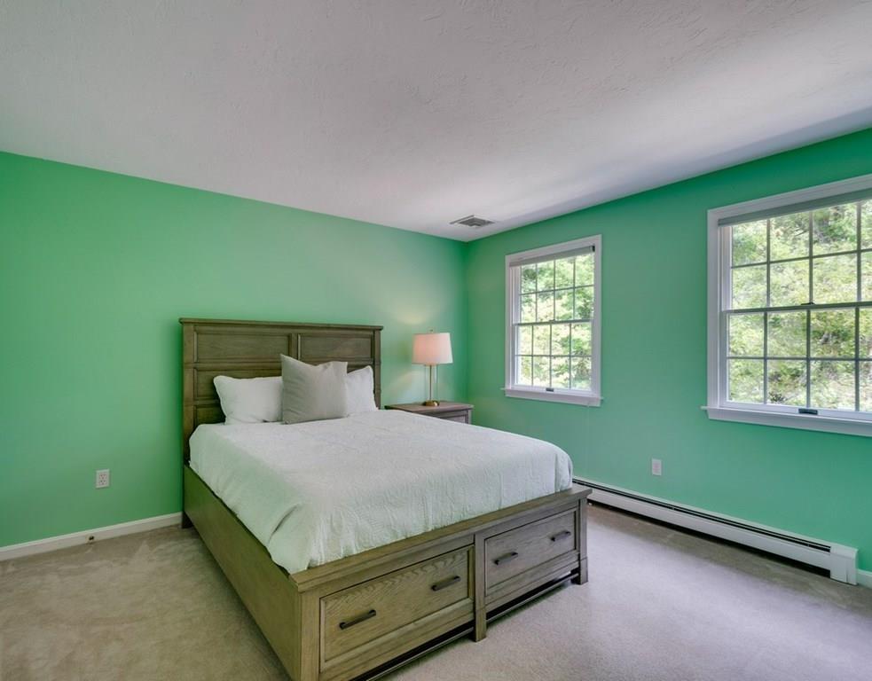 328 Joseph Road Boxborough, MA 01719 - Photo 14 of 34 a bed sitting in a room next to a window