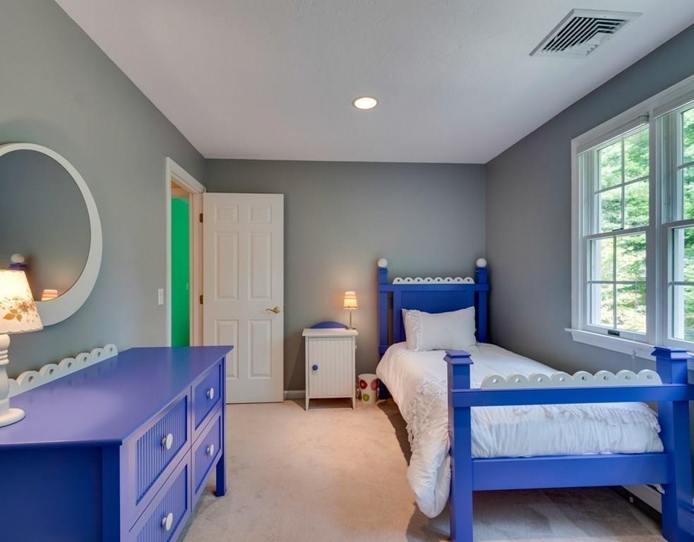 328 Joseph Road Boxborough, MA 01719 - Photo 16 of 34 a bedroom with a bed and a mirror