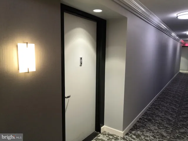 a view of a hallway with windows