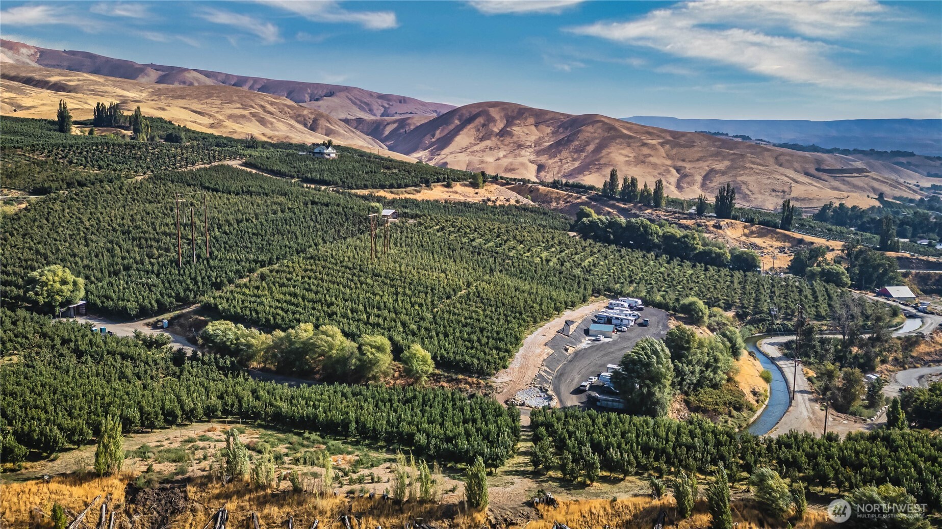 394 Lure Lane Wenatchee, WA 98801 - Photo 8 of 27 a view of a lush green hillside and houses