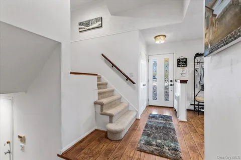 a view of entryway with wooden floor