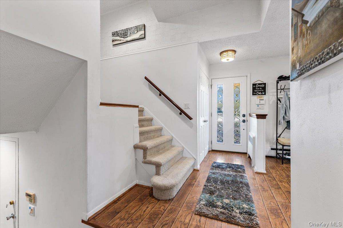 2 Doone Drive Syosset, NY 11791 - Photo 13 of 23 a view of entryway with wooden floor