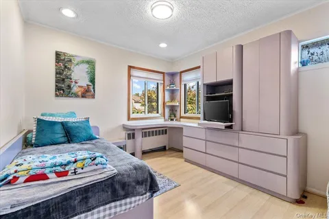 a bedroom with a bed and furniture