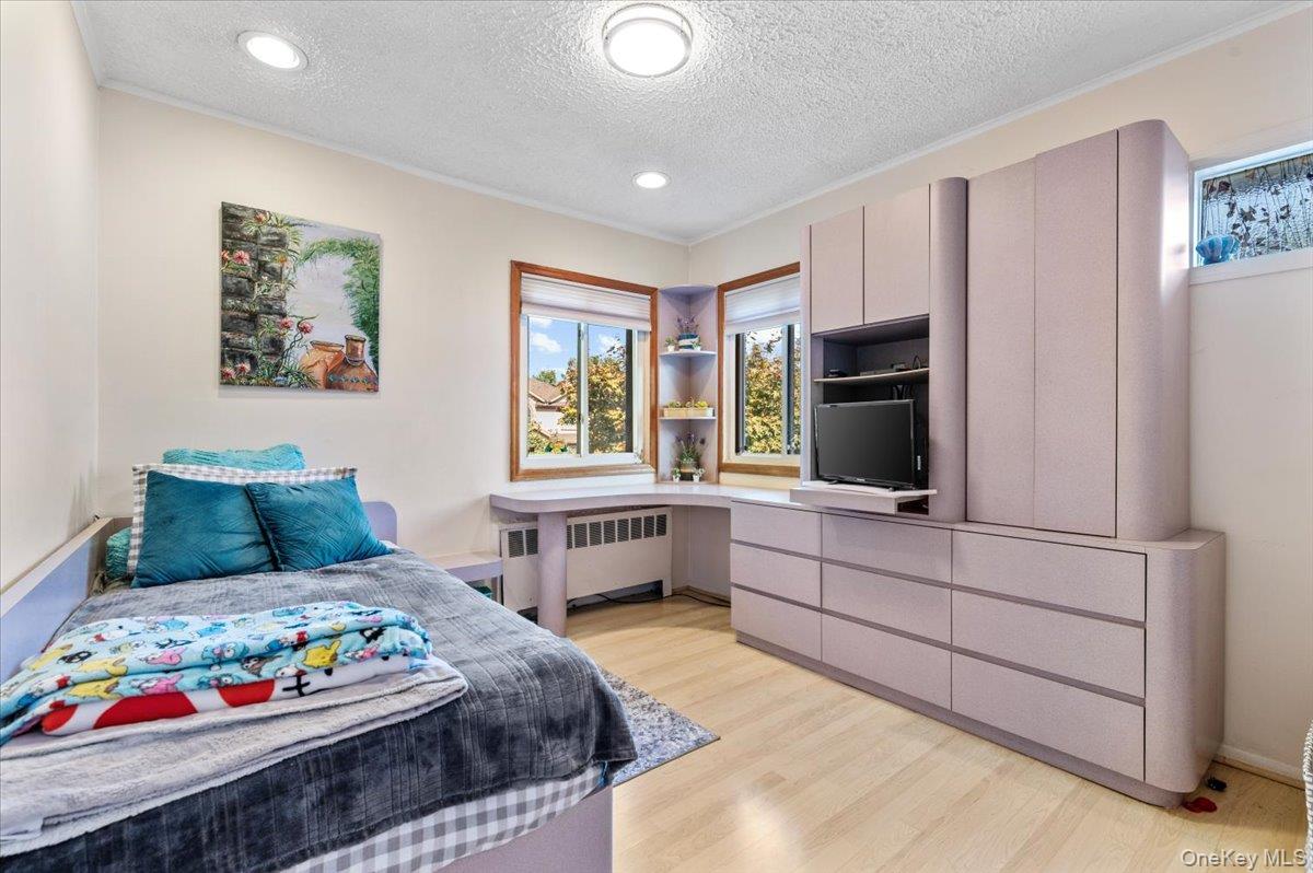 2 Doone Drive Syosset, NY 11791 - Photo 14 of 23 a bedroom with a bed and furniture