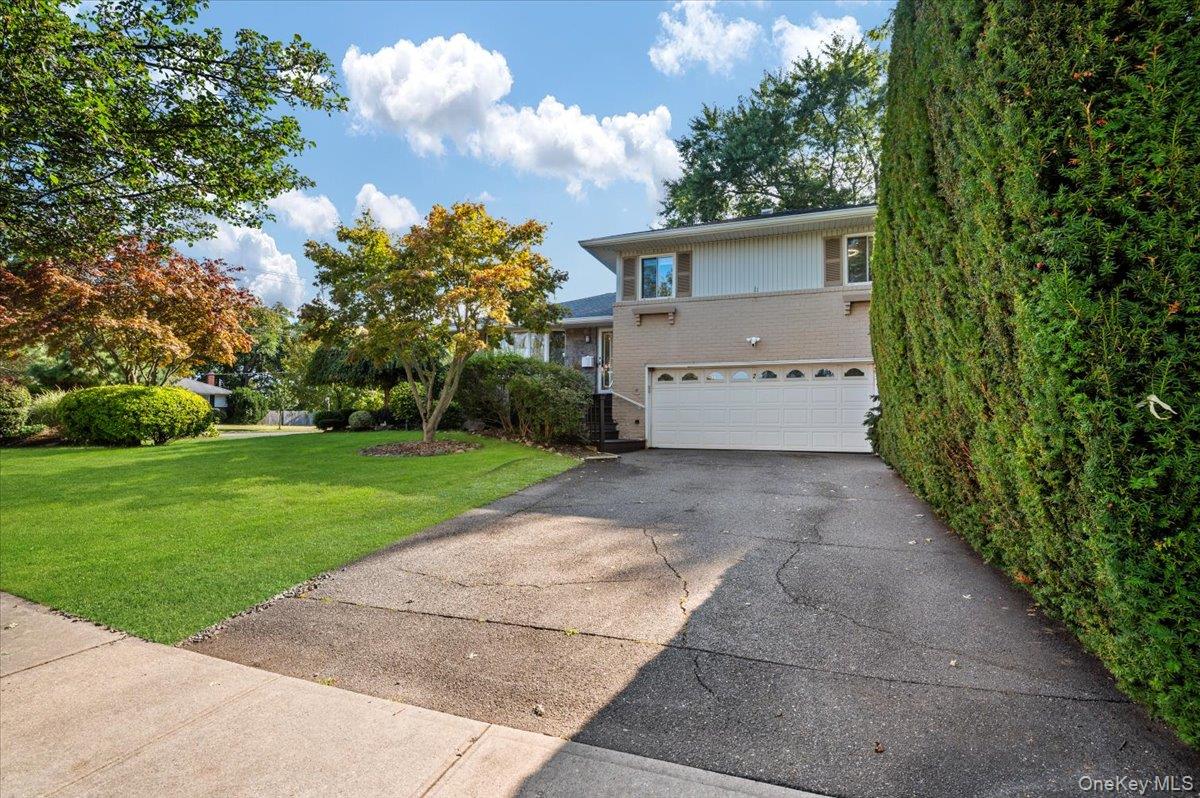 2 Doone Drive Syosset, NY 11791 - Photo 2 of 23 a view of a house with a yard
