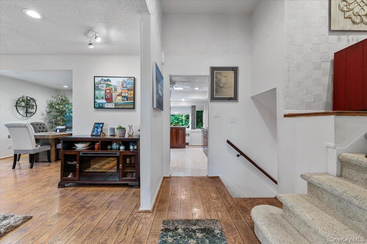 2 Doone Drive Syosset, NY 11791 - Photo 3 of 23 a living room with furniture and a wooden floor