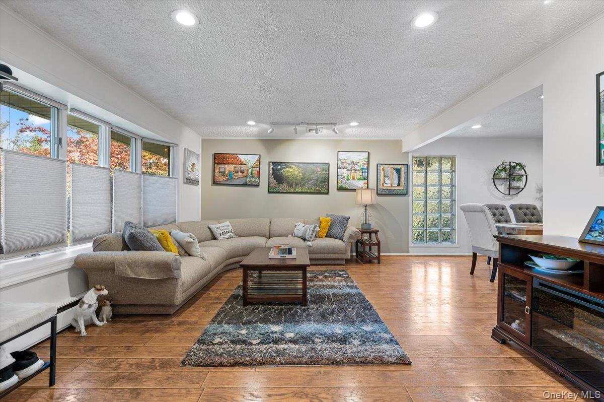 2 Doone Drive Syosset, NY 11791 - Photo 4 of 23 a living room with furniture hard wood floor and a table