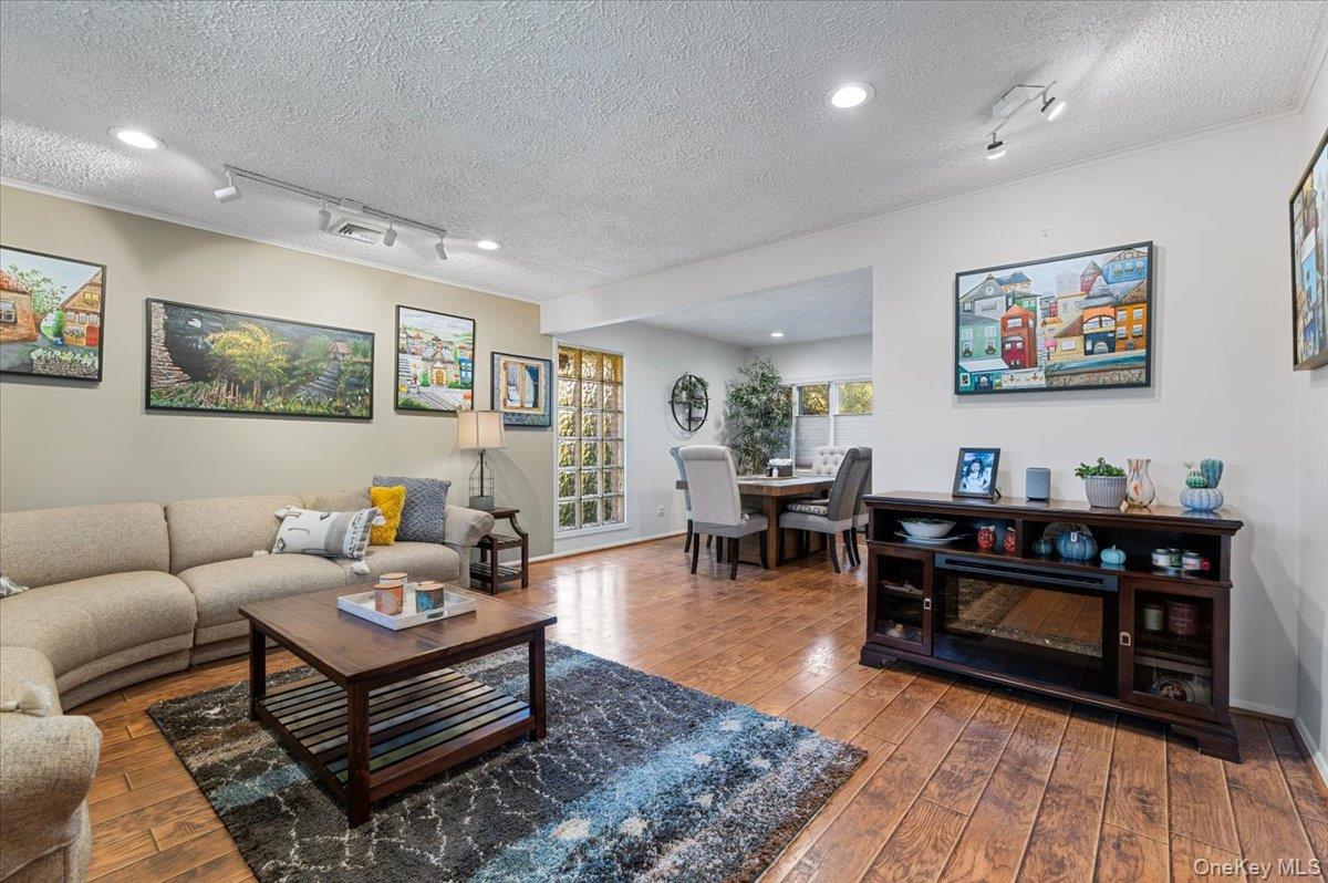 2 Doone Drive Syosset, NY 11791 - Photo 5 of 23 a living room with furniture and wooden floor