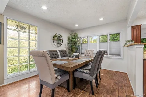 a view of a dining room with furniture window and outside view