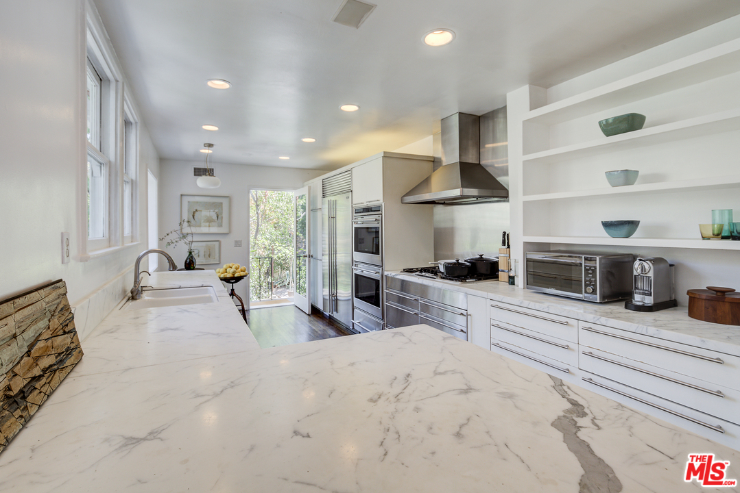 8420 La Tuna Canyon Road Sun Valley, CA 91352 - Photo 14 of 50 a view of a kitchen with furniture and a ceiling fan