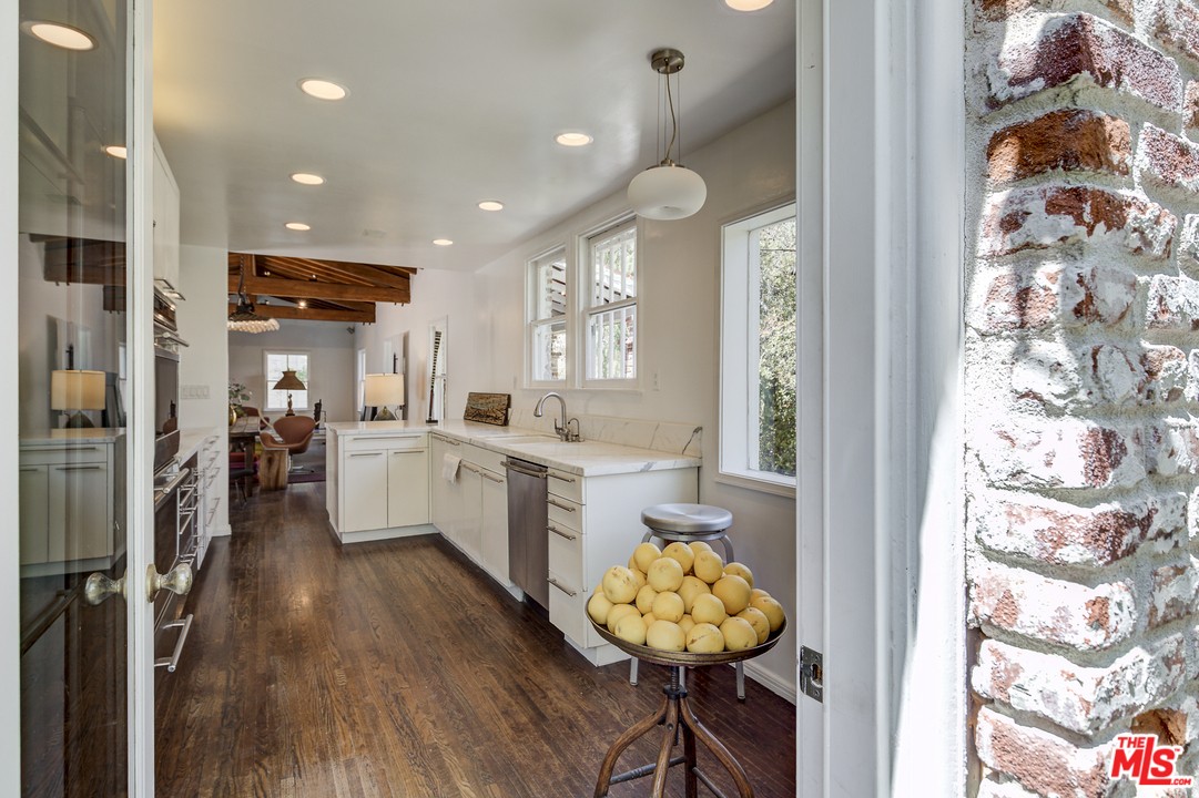 8420 La Tuna Canyon Road Sun Valley, CA 91352 - Photo 15 of 50 a view of a kitchen with furniture and wooden floor