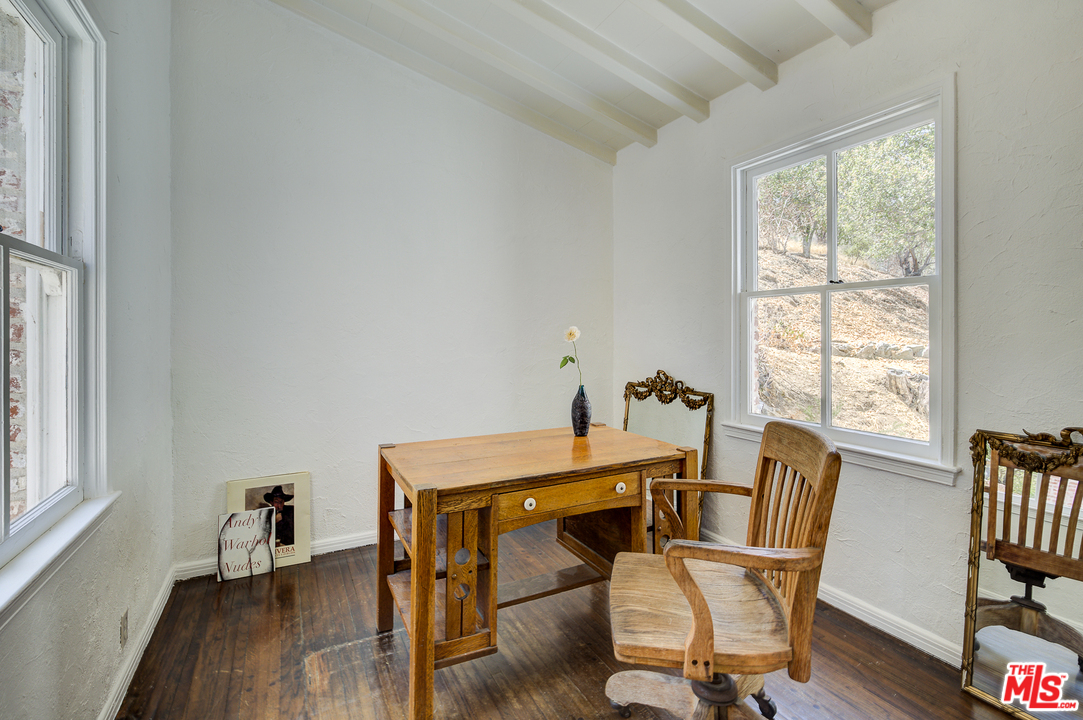 8420 La Tuna Canyon Road Sun Valley, CA 91352 - Photo 28 of 50 a dining room with furniture and wooden floor