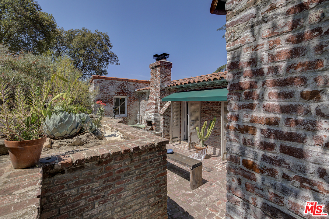 8420 La Tuna Canyon Road Sun Valley, CA 91352 - Photo 31 of 50 a front view of a house with outdoor seating