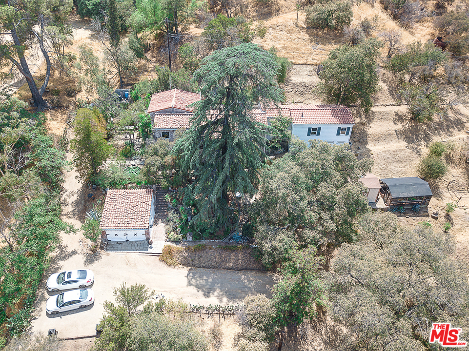 8420 La Tuna Canyon Road Sun Valley, CA 91352 - Photo 48 of 50 a aerial view of a house with a yard and large trees