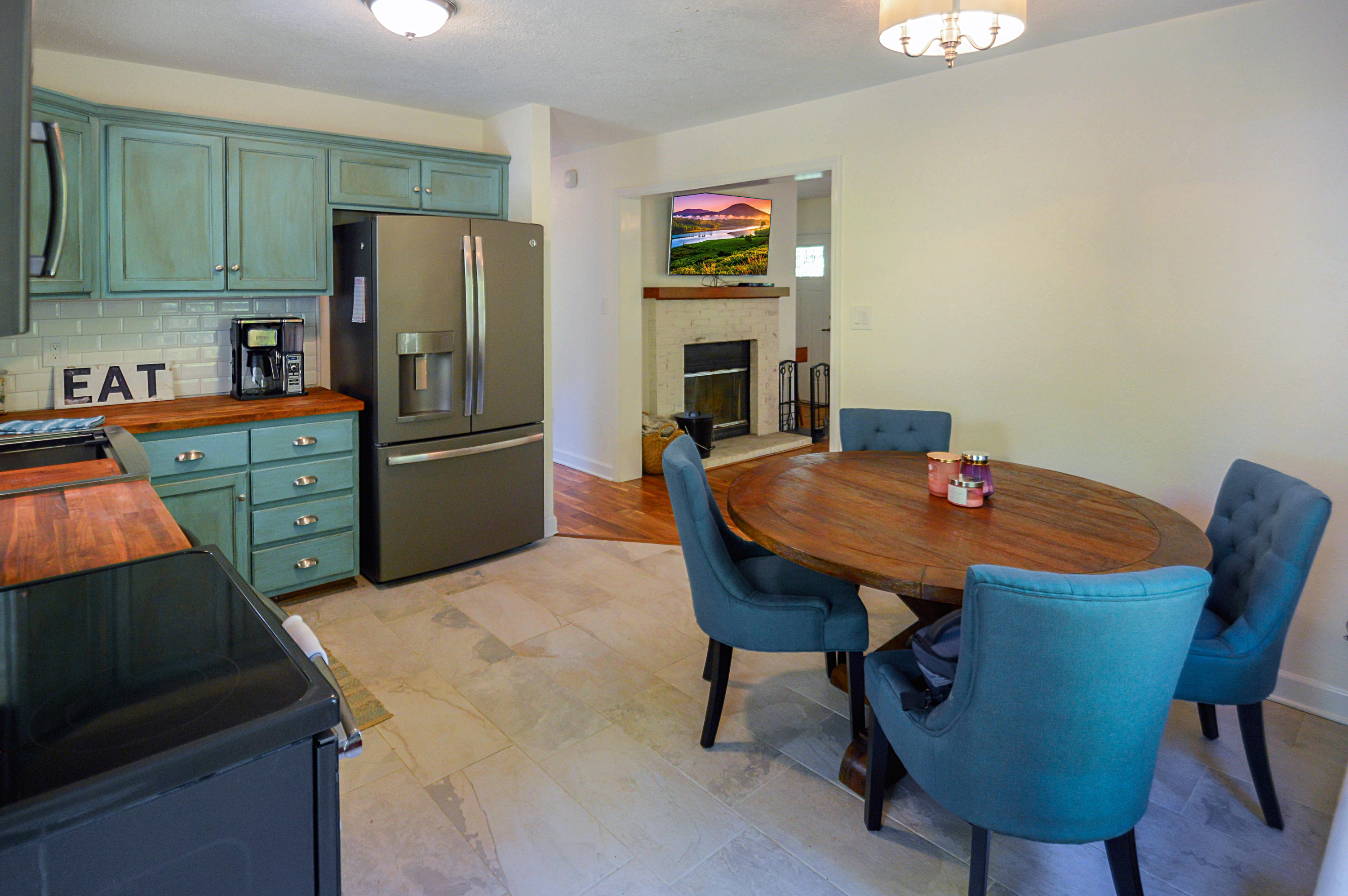 1280 Dryhill Road Ferrum, VA 24088 - Photo 15 of 58 a kitchen with stainless steel appliances a table chairs and a refrigerator