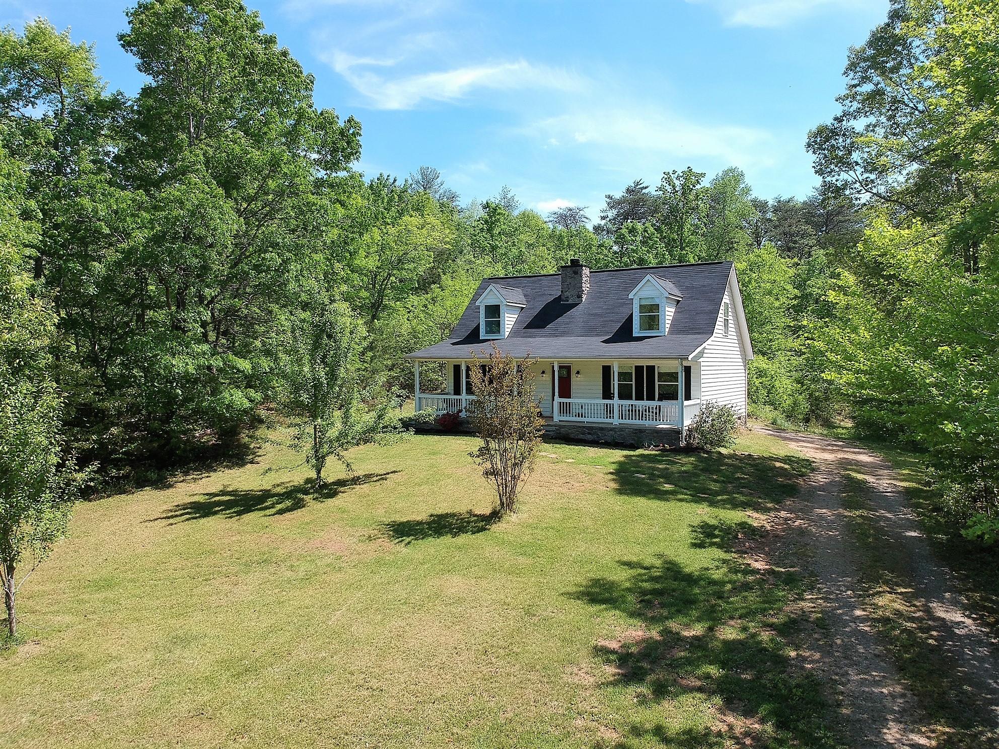 1280 Dryhill Road Ferrum, VA 24088 - Photo 41 of 58 a house with trees in the background