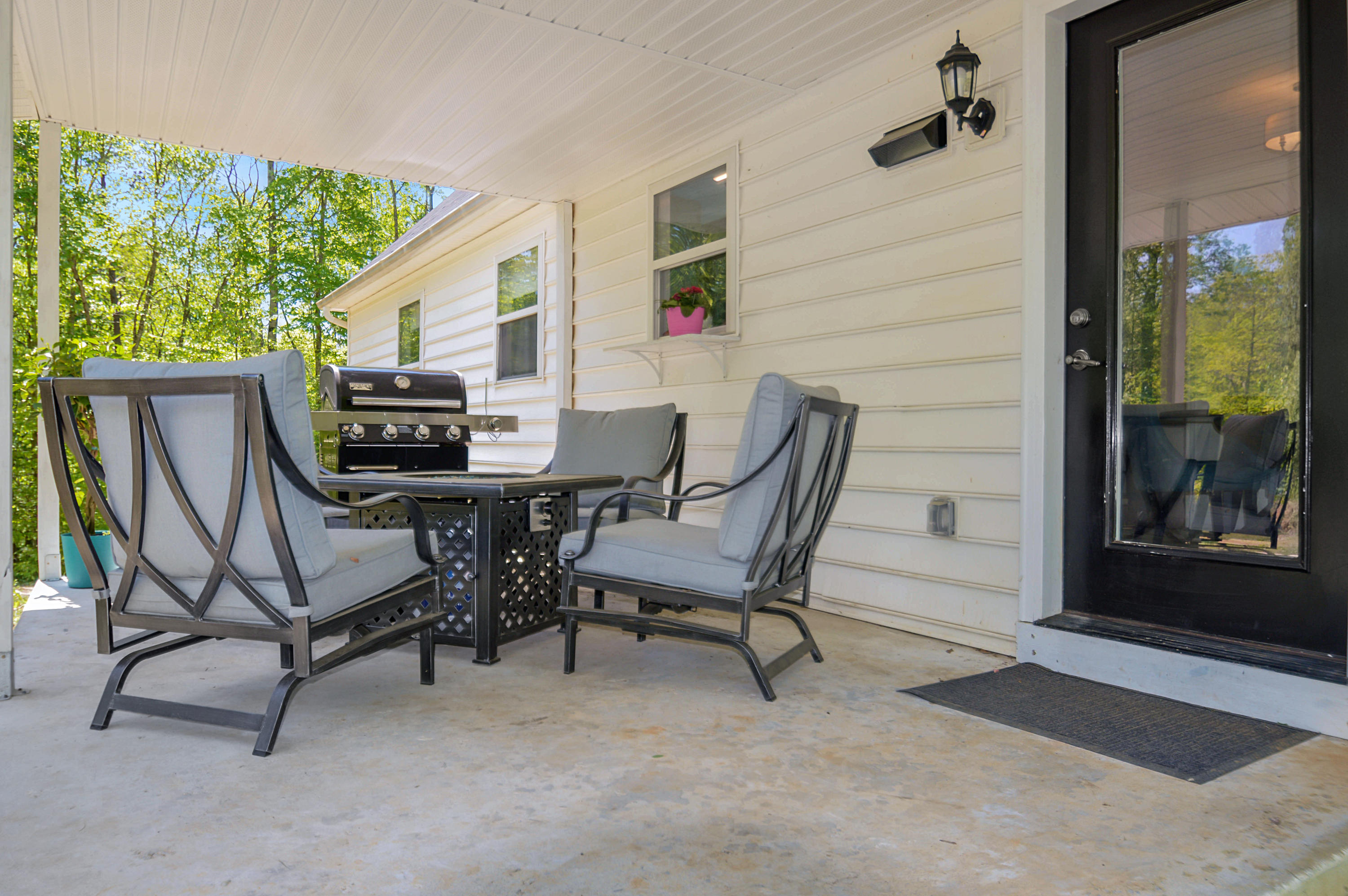 1280 Dryhill Road Ferrum, VA 24088 - Photo 45 of 58 a view of a patio with table and chairs with wooden floor and fence