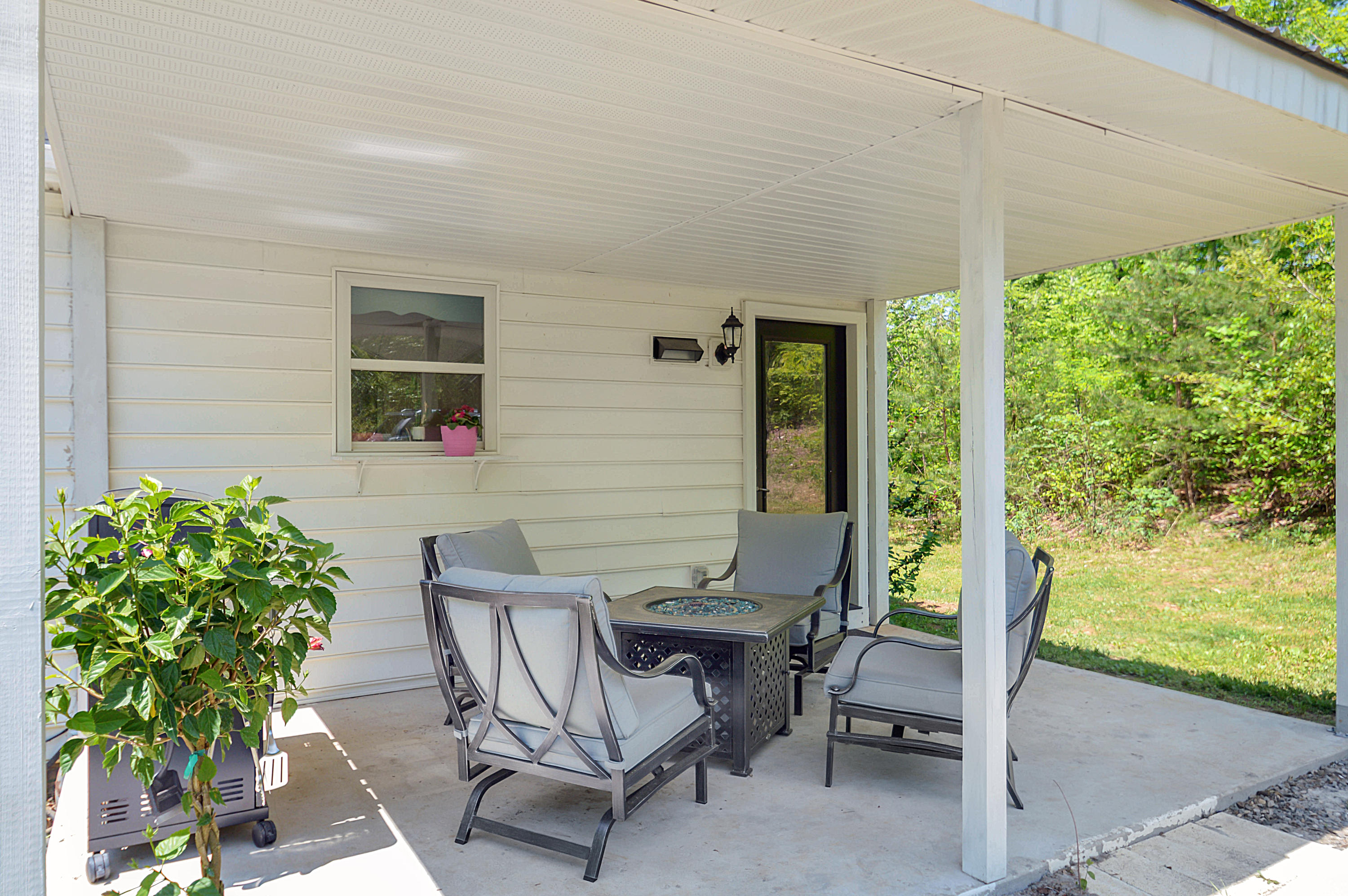 1280 Dryhill Road Ferrum, VA 24088 - Photo 46 of 58 a view of a patio with table and chairs and potted plants