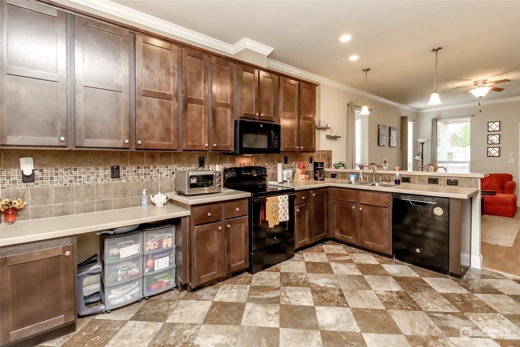 828 Mountain Villa Drive Enumclaw, WA 98022 - Photo 12 of 34 a kitchen with a sink stove and cabinets