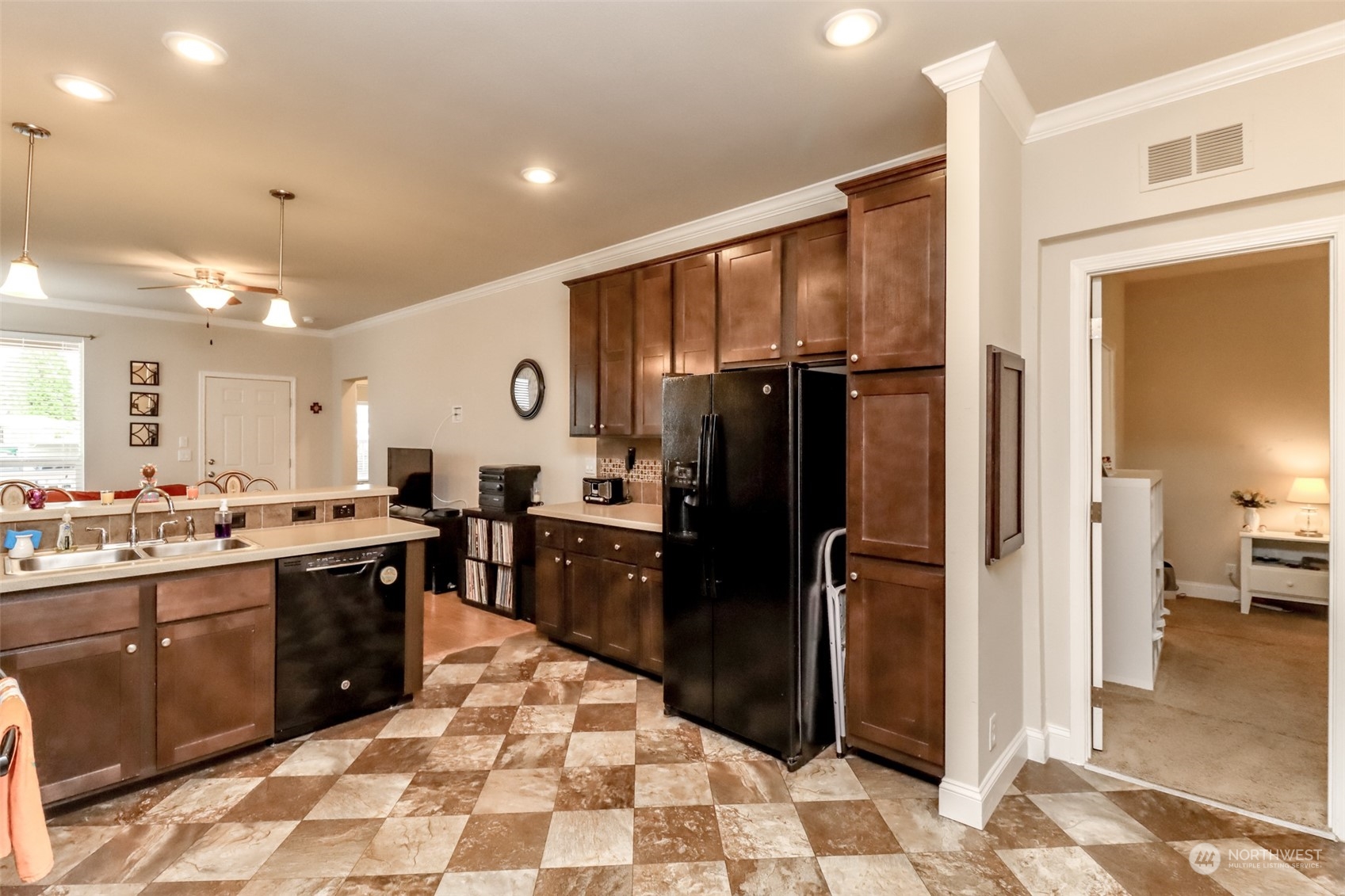 828 Mountain Villa Drive Enumclaw, WA 98022 - Photo 14 of 34 a kitchen with stainless steel appliances granite countertop a refrigerator and a sink