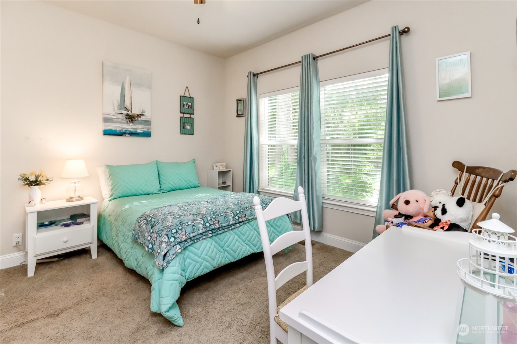 828 Mountain Villa Drive Enumclaw, WA 98022 - Photo 17 of 34 a bedroom with a bed and windows