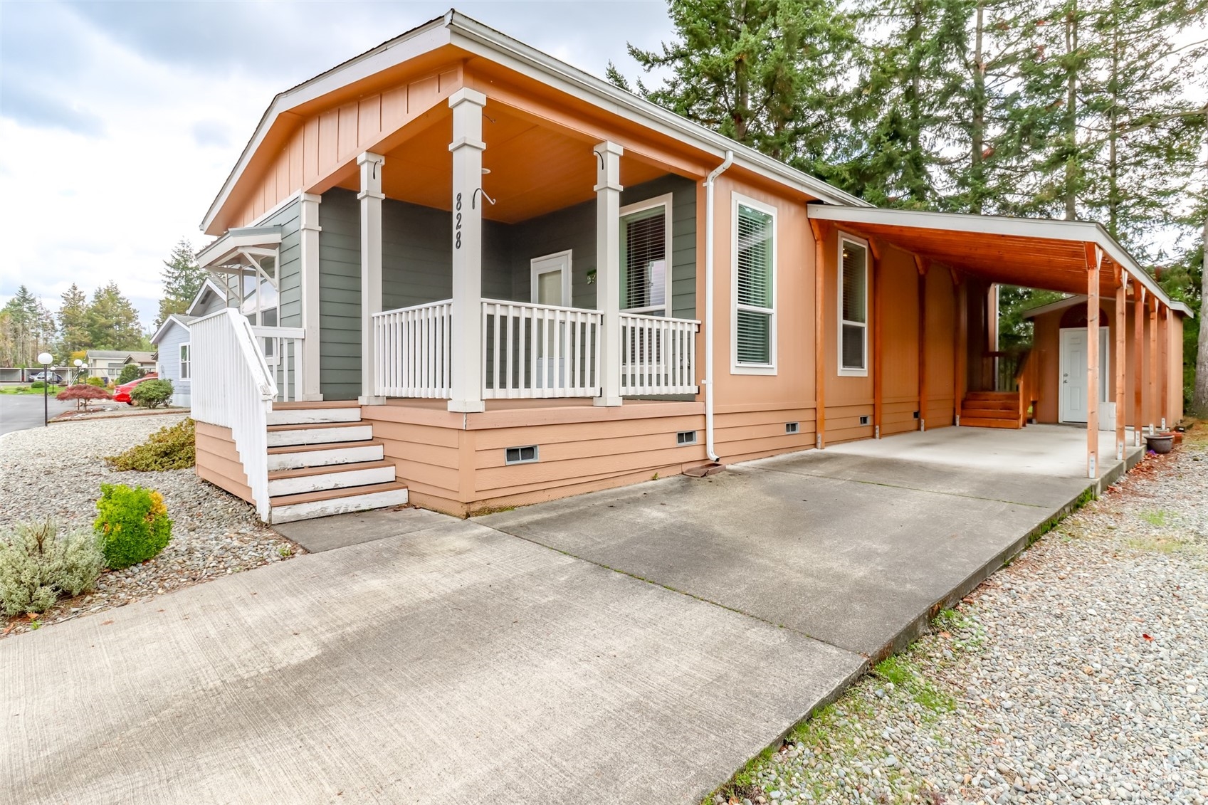 828 Mountain Villa Drive Enumclaw, WA 98022 - Photo 2 of 34 a backyard of a house with yard and outdoor seating
