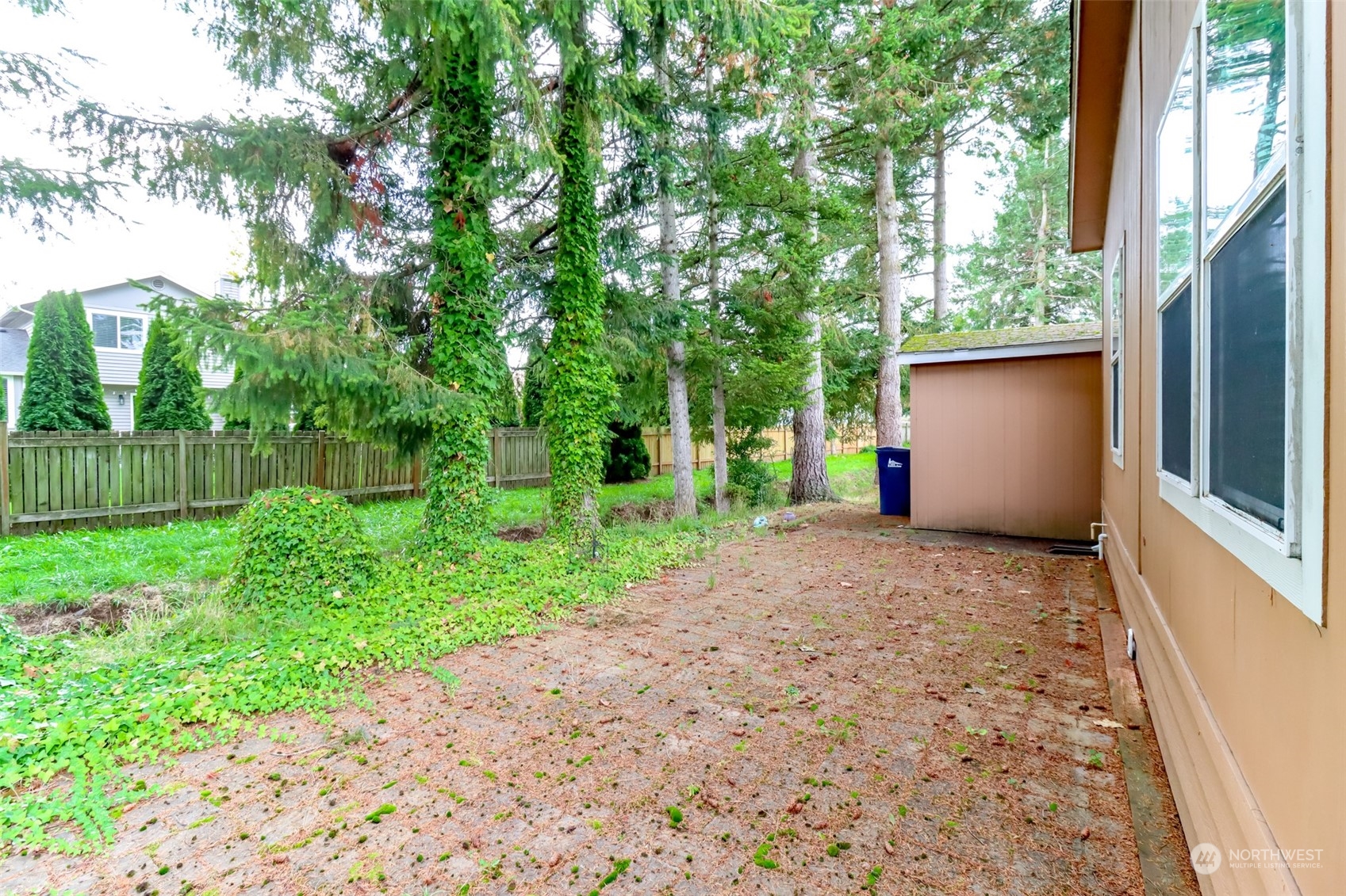 828 Mountain Villa Drive Enumclaw, WA 98022 - Photo 32 of 34 a view of a house with a backyard and a tree