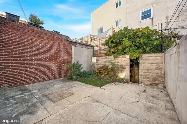 a view of a pathway both side of house