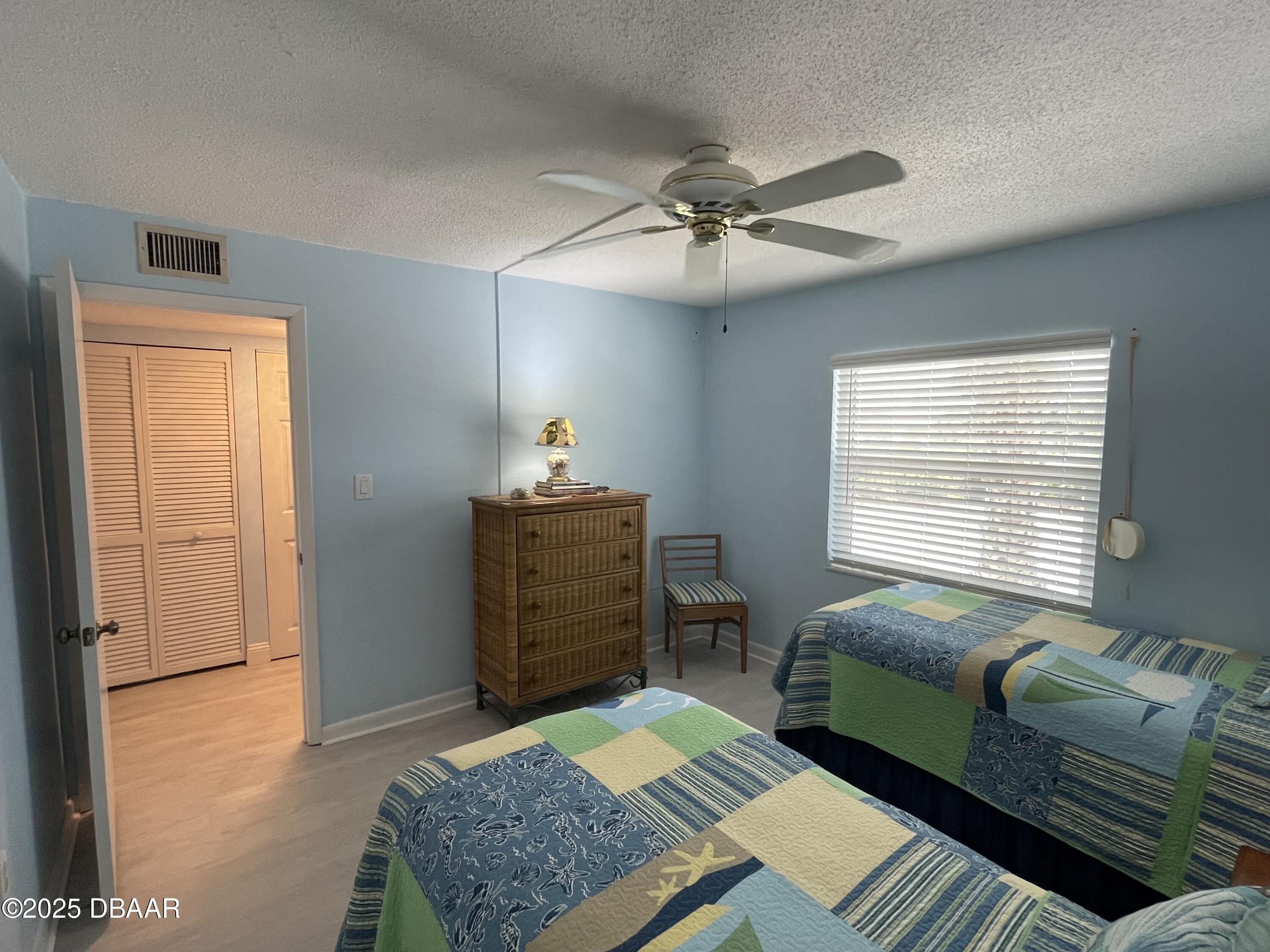 3390 Ocean Shore Boulevard, Unit 101 Ormond Beach, FL 32176 - Photo 17 of 33 a living room with furniture and a window