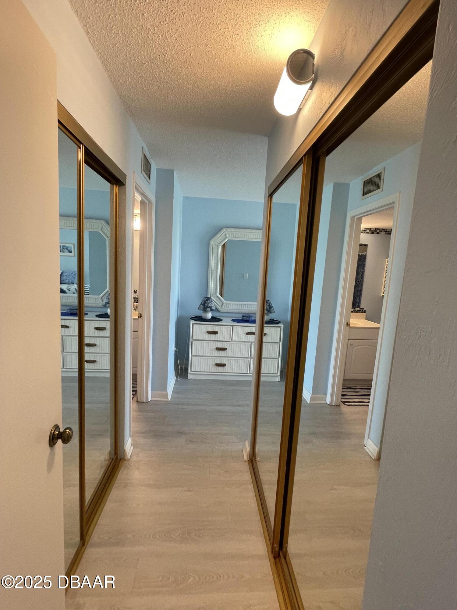 3390 Ocean Shore Boulevard, Unit 101 Ormond Beach, FL 32176 - Photo 20 of 33 a view of a bathroom from the hallway