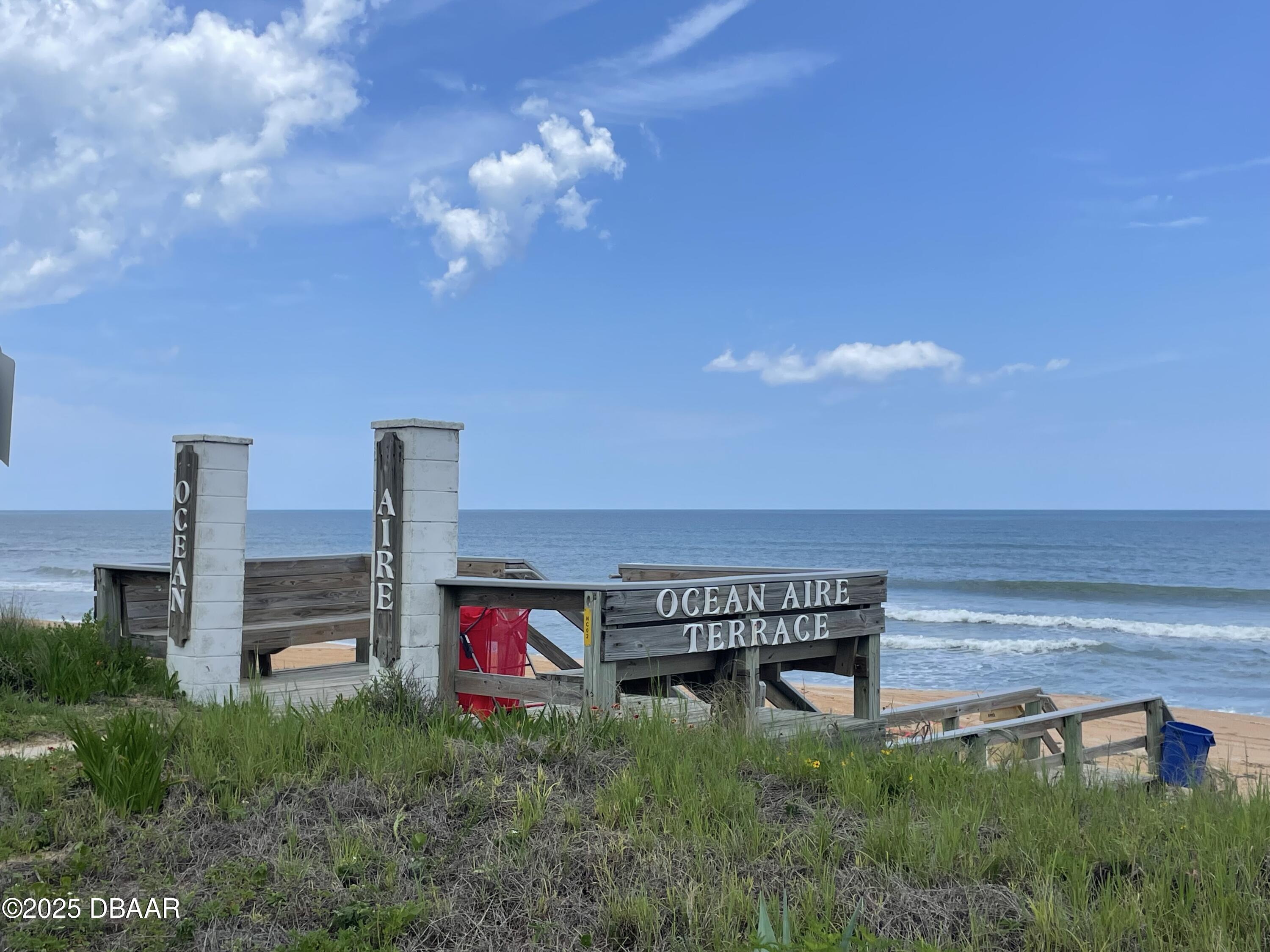 3390 Ocean Shore Boulevard, Unit 101 Ormond Beach, FL 32176 - Photo 28 of 33 a view of a hall with an empty room