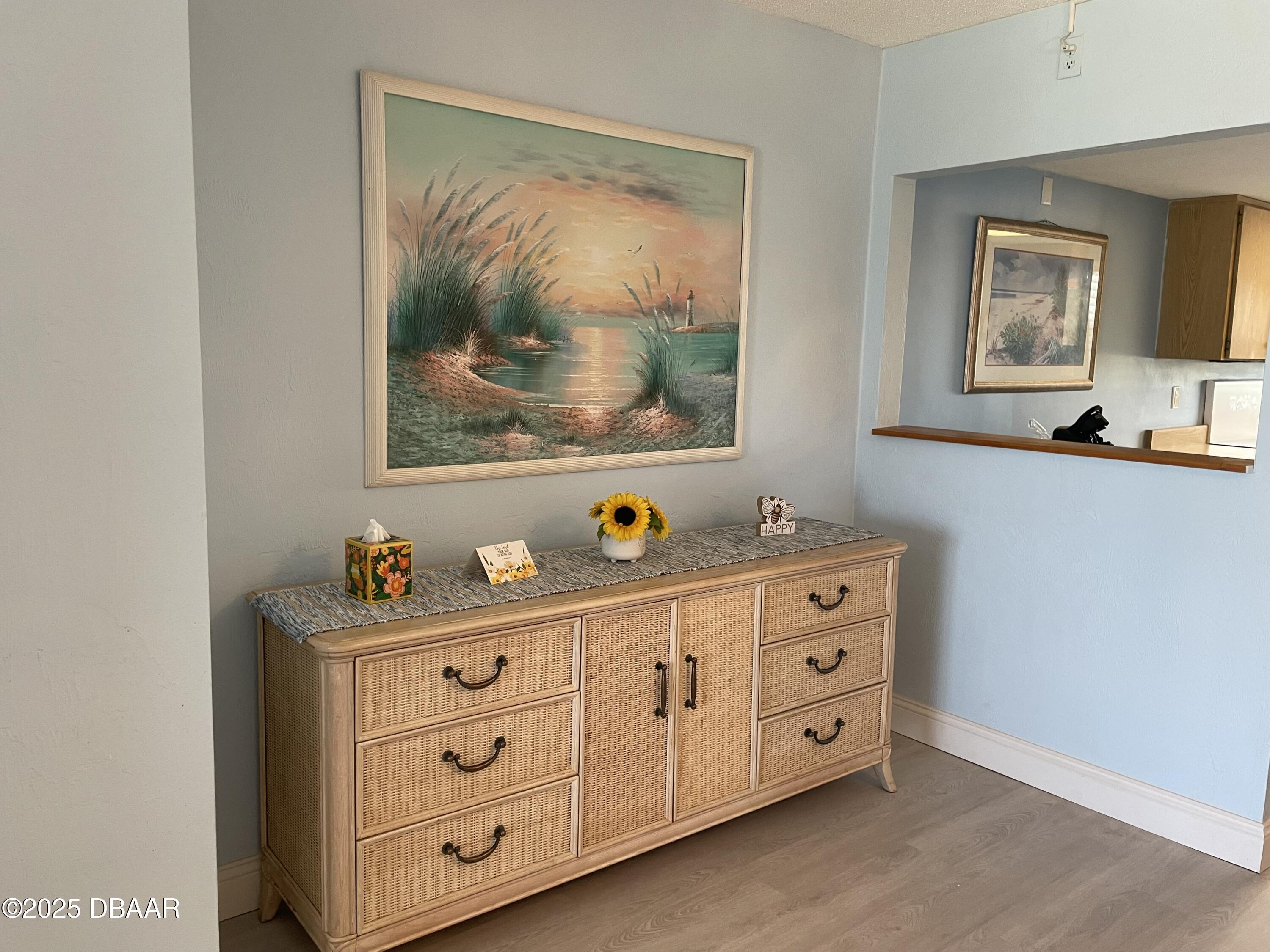 3390 Ocean Shore Boulevard, Unit 101 Ormond Beach, FL 32176 - Photo 7 of 33 a room with cabinets and window