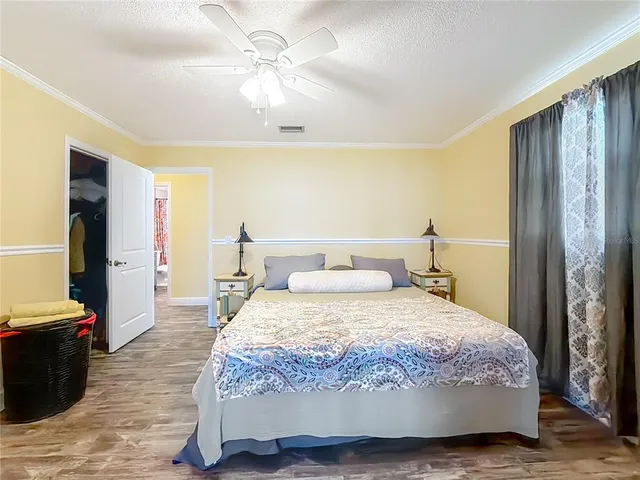 a view of a house with swimming pool and sitting area