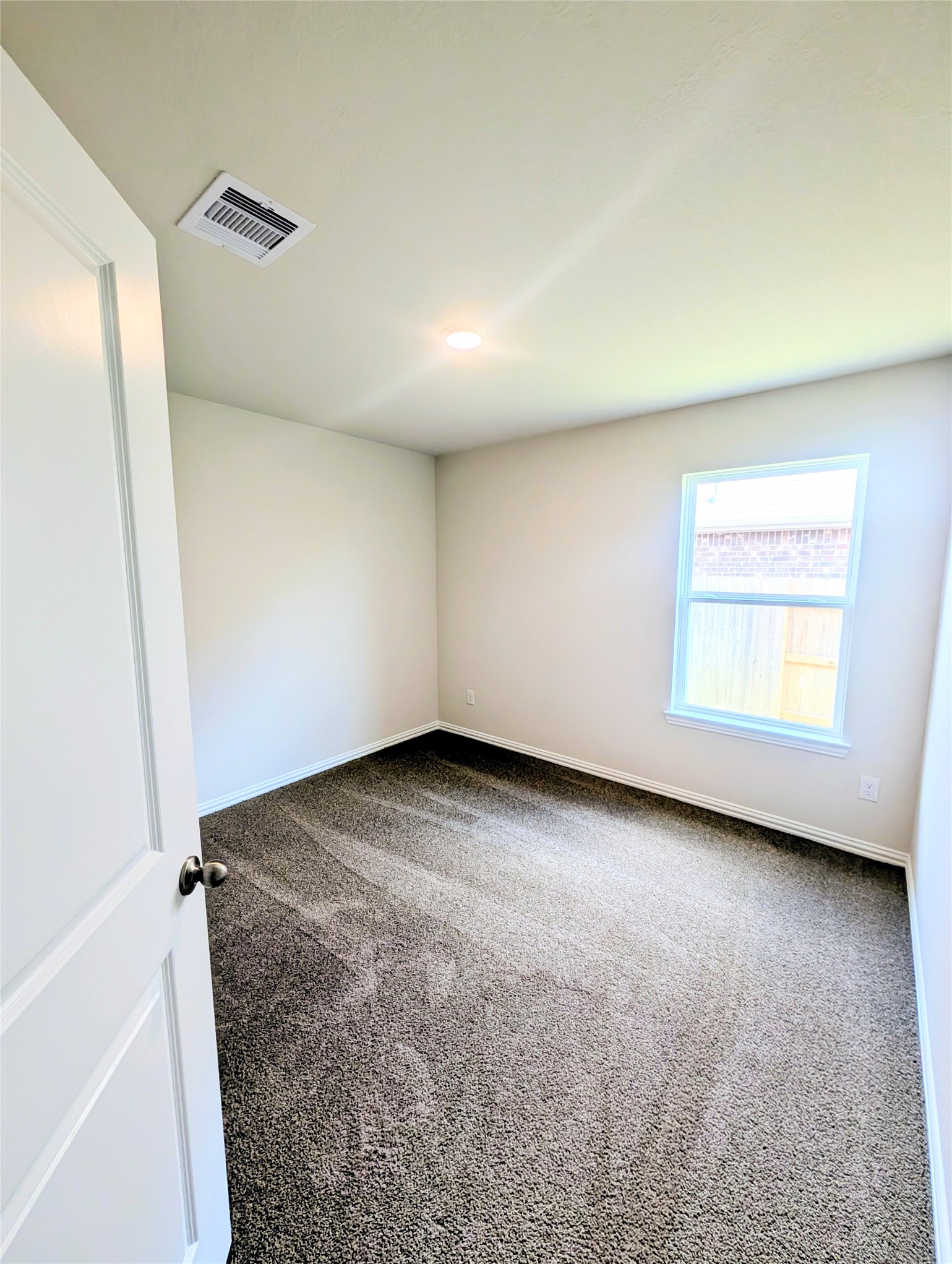 32314 Mimosa Ridge Lane Waller, TX 77484 - Photo 14 of 16 an empty room with a empty space and windows