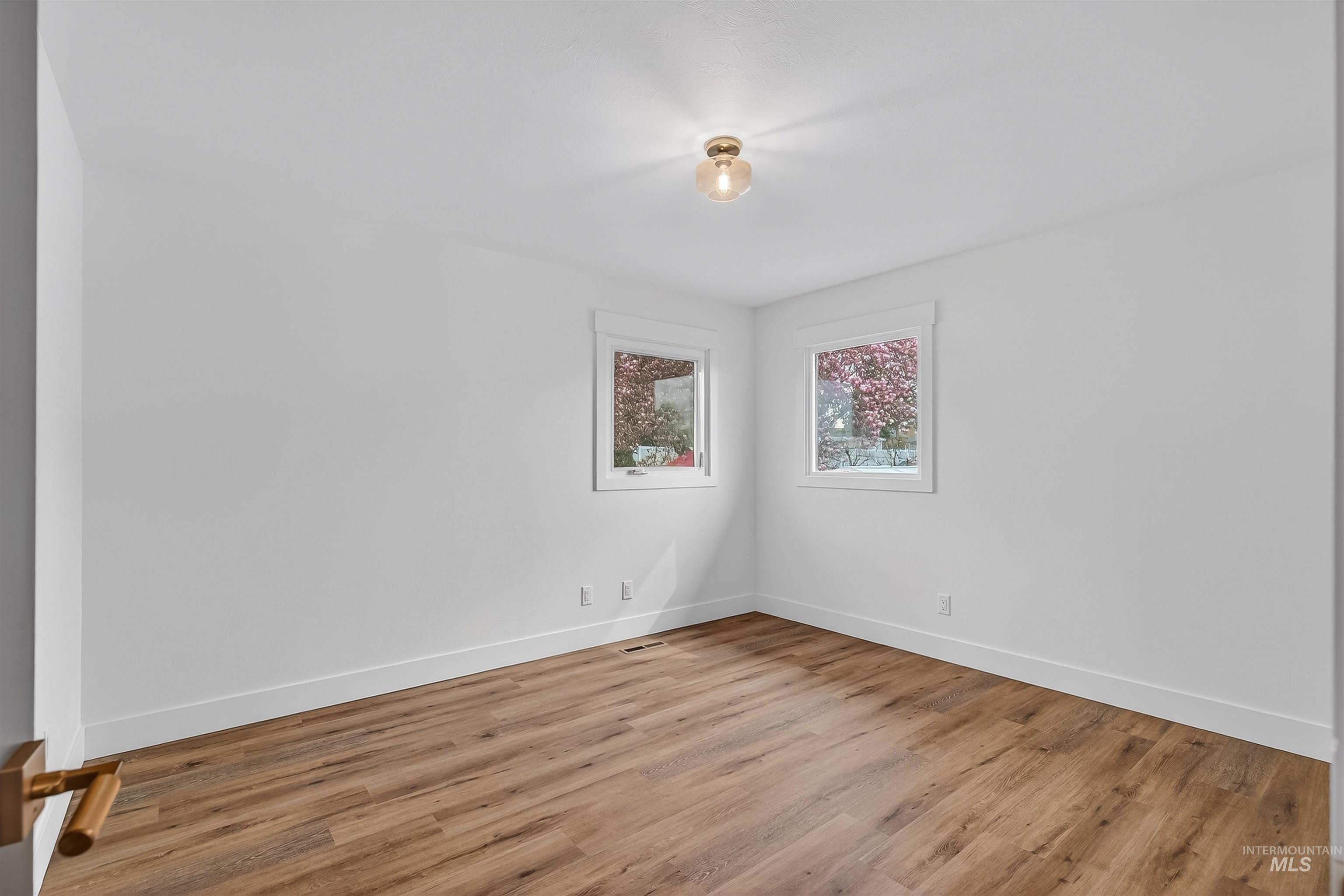 3513 8th Street Lewiston, ID 83501 - Photo 30 of 41 Spare room with light wood-type flooring and baseboards