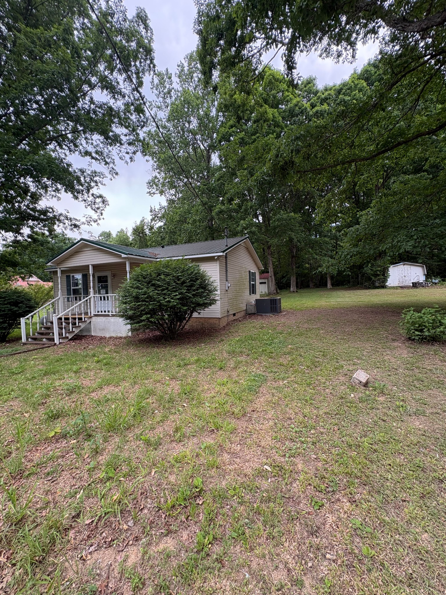 2174 Pleasant Hill Road Lynchburg, TN 37352 - Photo 11 of 16 a view of a house with backyard and sitting area