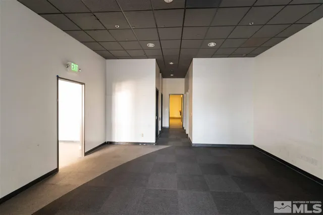 an empty room with wooden floor