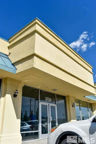 a view of a balcony with furniture
